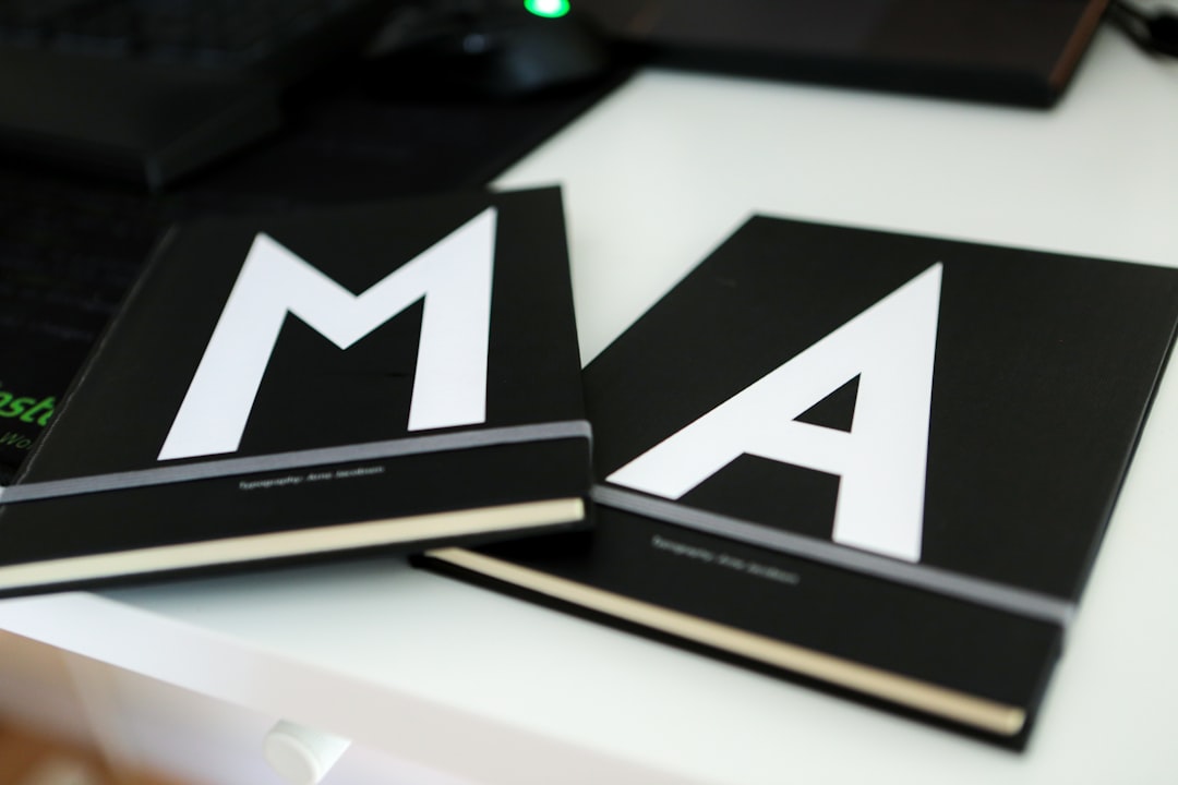 Mastering the First Impression: Your intriguing post title goes here Two black monogrammed notebooks used for digital marketing notes at the PRAGM office